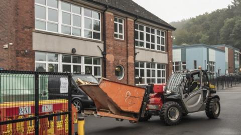 Workmen at a primary school in Sheffield.