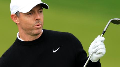 Rory McIlroy puffing out his cheeks while holding a golf club during round one of the 2026 US PGA Championship