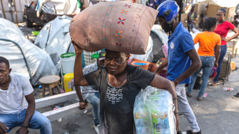 A woman with aid relief in Port-au-Prince