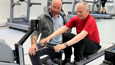 Patient using a rowing machine at the 'prehabilitation' gym