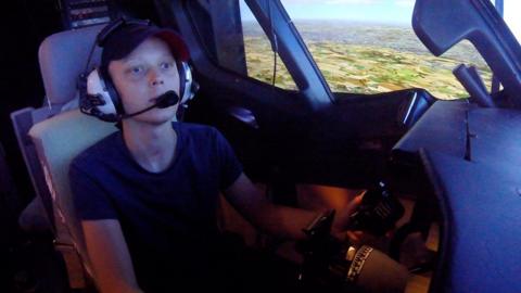 Toby Brooker in a flight simulator