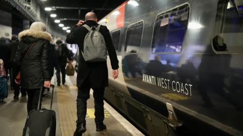 Avanti train in London at the platform with people boarding