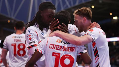 Bolton celebrate Amario Cozier-Duberry's goal against Bradford