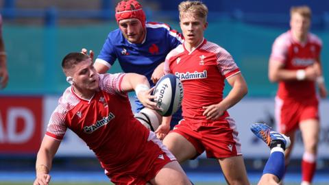 Oli Burrows in action for Wales Under-20s