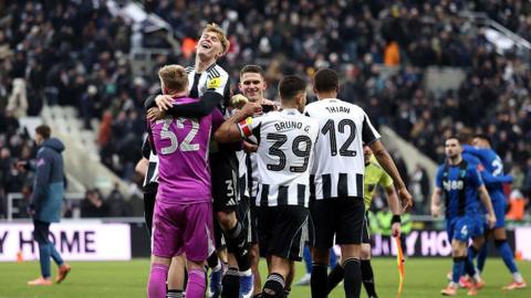 Aaron Ramsdale celebrates with his team-mates after Newcastle United's penalty shootout win against Bournemouth in the FA Cup third round tie at St James' Park on 10 January, 2026