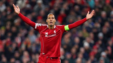 Virgil van Dijk holds arms up in frustration