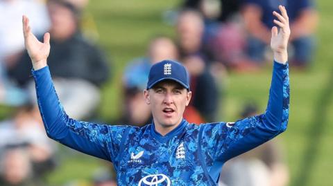 England captain Harry Brook puts his hands up in the air while fielding during the second ODI against New Zealand