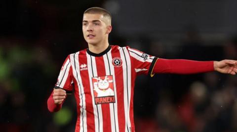 Sheffield United's Alfie Gilchrist pointing outstretched with his left hand