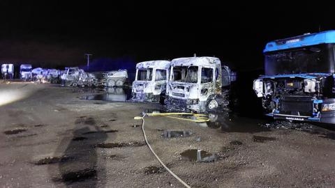 The burnt out lorries at Mulberry Farm, Station Road, Longstanton