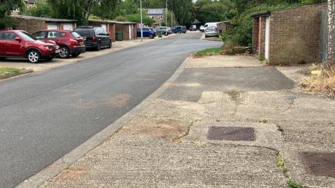 Blood stains on the road at the site of the attack in Watergall