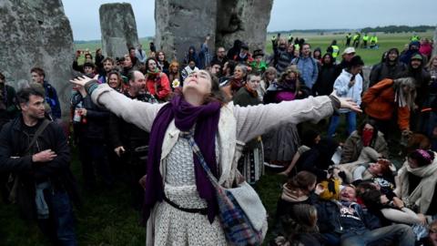 Revellers gather to celebrate the Summer Solstice at Stonehenge ancient stone circle, despite official events being cancelled amid the spread of the coronavirus disease