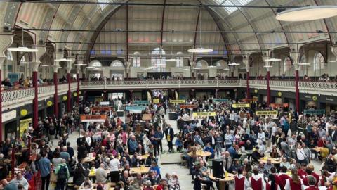 Large crowds inside a newly-refurbished Derby's Market Hall taken from the top terrace
