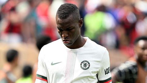 Nicolas Jackson walking off the pitch after being sent off 