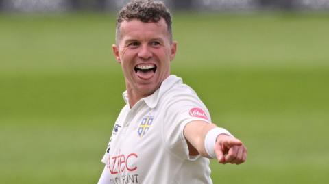 Peter Siddle takes a wicket for Durham