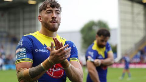 Matty Ashton applauds the Warrington Wolves fans after the win over St Helens 