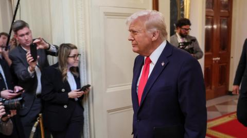 U.S. President Donald Trump walks on the day that he hosts the 2024 Stanley Cup Champions, the Florida Panthers in the East Room at the White House in Washington, 