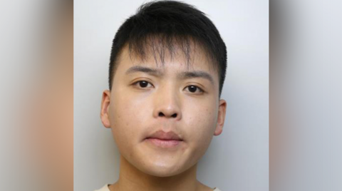 Mushot of Daoyan Shang, 20, involved in a phone "smishing" scam on the tube 