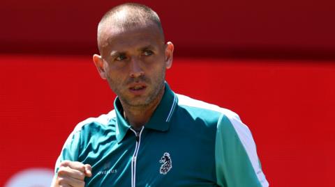 Dan Evans celebrates