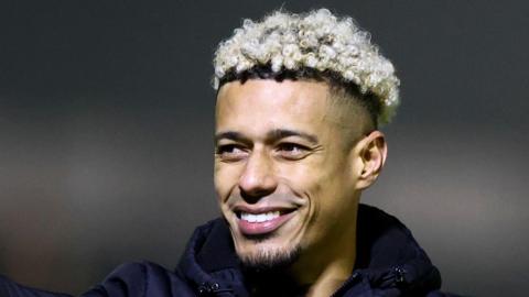 Lyle Taylor smiles following a win over Bromley in January