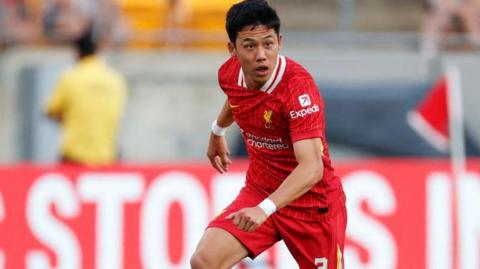 Wataru Endo in action for Liverpool