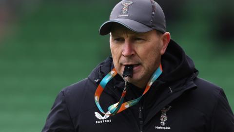 Harlequins head coach Jason Gilmore blows his whistle in training