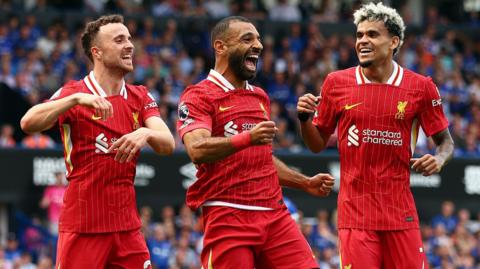 Mohamed Salah celebrates with Diogo Jota and Luis Diaz after doubling Liverpool's lead at Portman Road