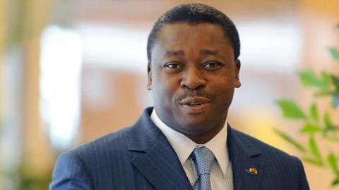 Togo's President Faure Gnassingbe waves as he arrives for an ECOWAS Summit gathering west African leaders to plot a military strategy to wrest control of northern Mali from Islamist groups as fears grow over the risks they pose to the region and beyond, on November 11, 2012 in Abuja