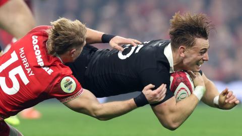 Ruben Love scores New Zealand's second try against Wales in Cardiff