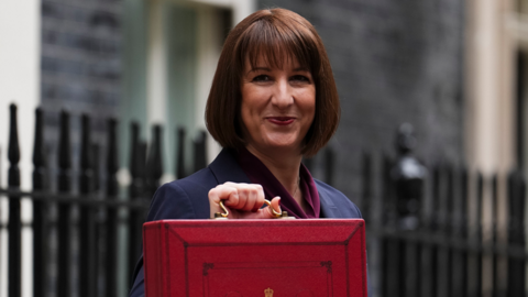 Chancellor Rachel Reeves holding the red briefcase associated with the Budget announcement as she stands on Downing Street