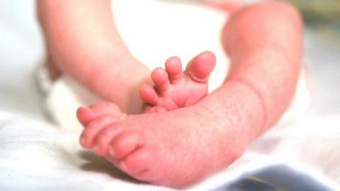 Feet of newborn baby