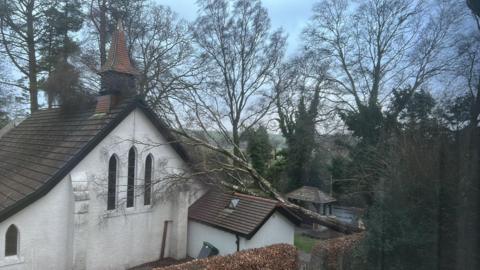 A tree down on a church roof in New Galloway