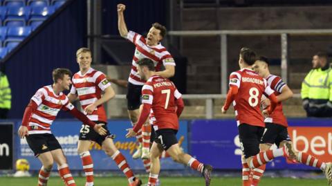 Doncaster celebrate Luke Molyneux's second goal