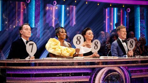 Strictly Judges holding their paddles