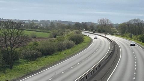 The A1 in Nottinghamshire near North Muskham. There are only a couple of cars on the carriageways after the road had recently reopened.
