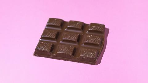 Nine blocks (still together) of dark chocolate in a rectangle shape 