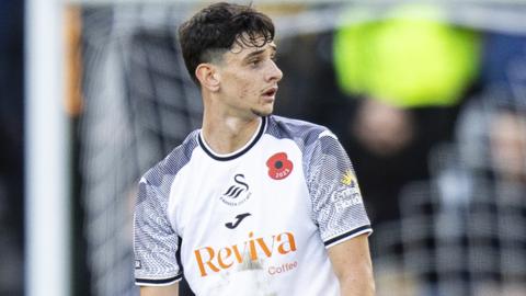 Charlie Patino reacts to his red card