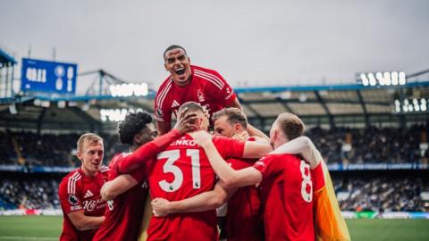 Nottingham Forest's players celebrate Chris Wood opening the scoring against Chelsea