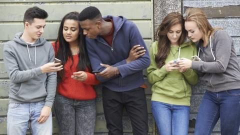 Teens using smartphones