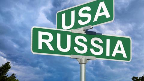 Signs saying USA and Russia