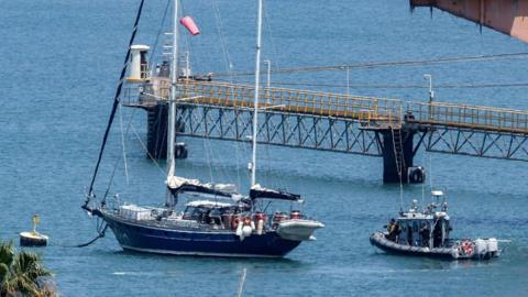 An Israeli patrol boat near the Madleen yacht as it moored at the port of Ashdod in Israel on 10 June.