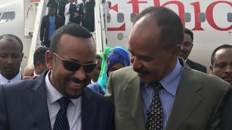 President Isaias Afwerki puts his arm around Prime Minister Abiy Ahmed