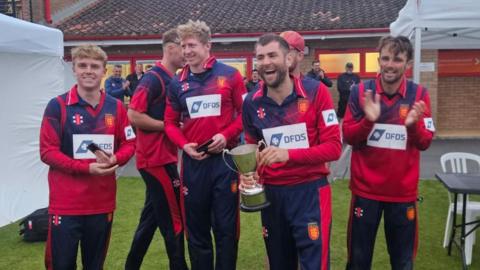 Jersey captain Charles Perchard holds the inter-island T20 trophy