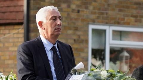 Sir Lindsay Hoyle holding flowers in Leigh-on-Sea, 16 October 2021