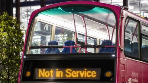 Translink Metro bus with sign saying 'Not in Service' in Belfast City centre.