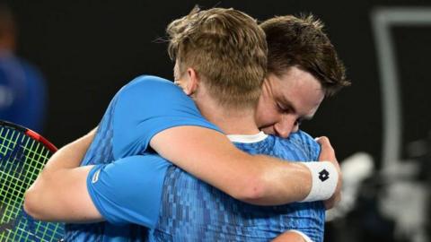 Britain's Henry Patten and Finnish team-mate Harri Heliovaara embrace in celebration after winning the Australian Open men's doubles title