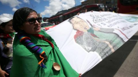 A woman takes part in a protest as a national strike continues in Bogota, Colombia December 4, 2019.