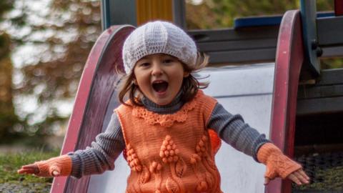 Girl on slide