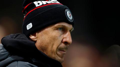 Bristol City boss Gerhard Struber pictured wearing a bobble hat