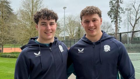 Declan Treacey (left) stands with his arm around brother Connor (right)