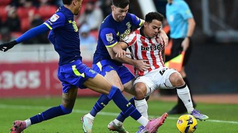 Stoke City's Million Manhoef battles for possession with Preston's Andrew Hughes